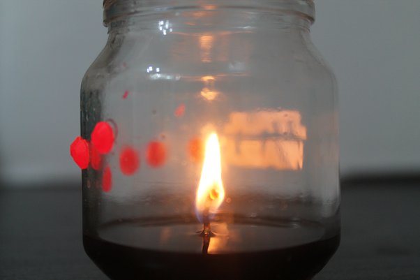 can a candle in a glass jar start a fire